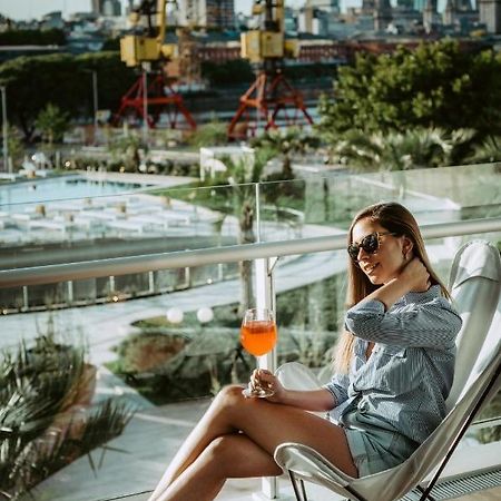 Sls Buenos Aires Puerto Madero Hotel Ngoại thất bức ảnh A woman drinking an Aperol Spritz