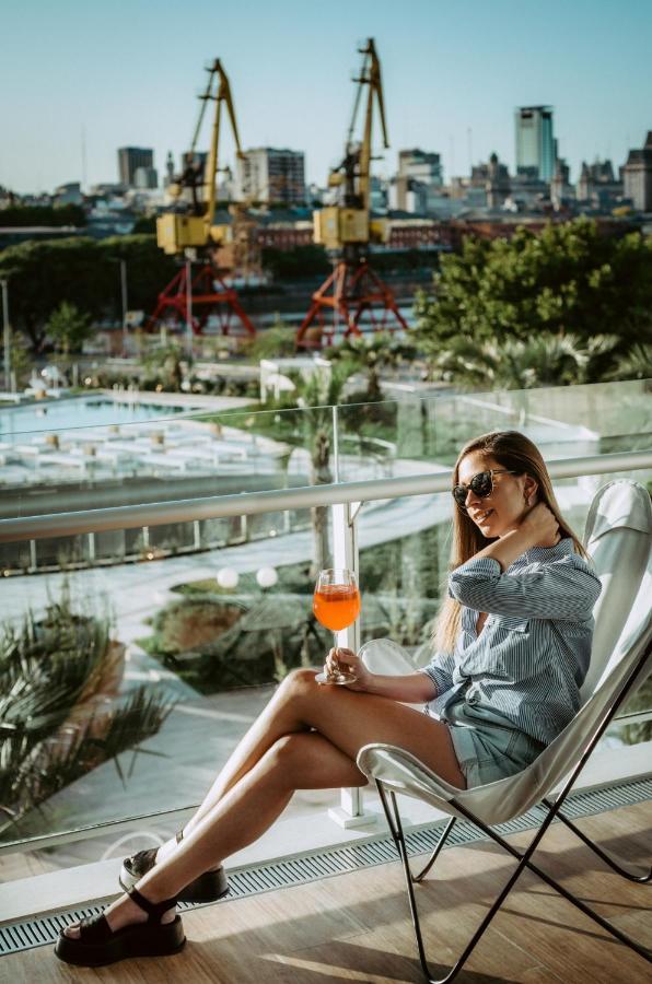 Sls Buenos Aires Puerto Madero Hotel Ngoại thất bức ảnh A woman drinking an Aperol Spritz